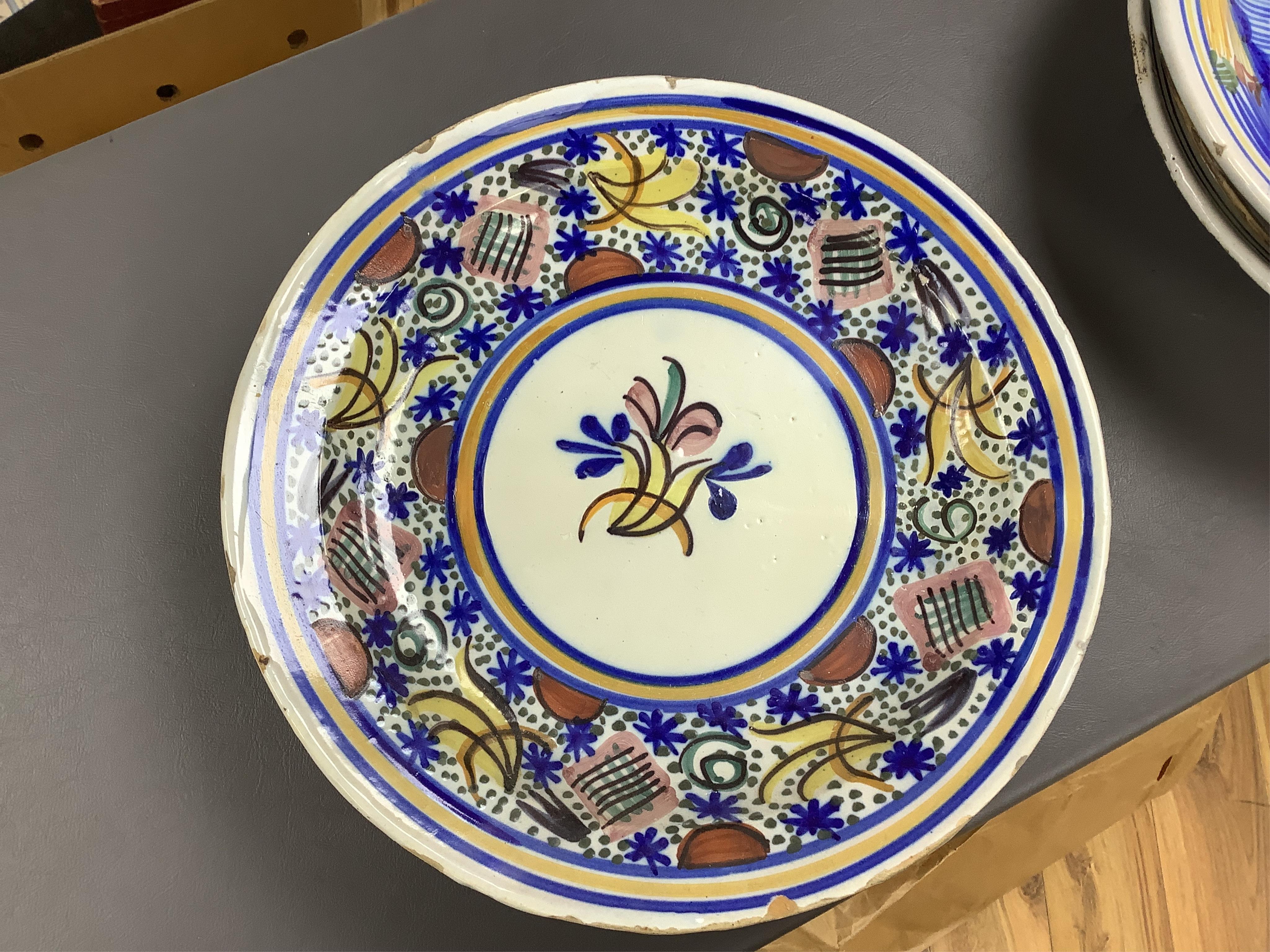 18th and 19th century faience including five chargers and large bowl, latter 30cm